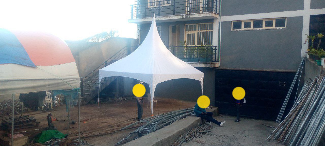 engineers installing tent at work